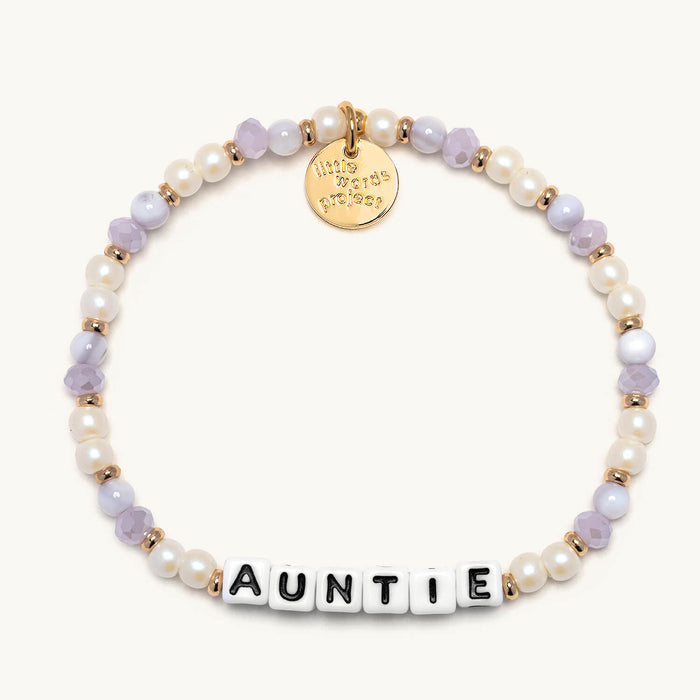 Pearl bracelet with 'AUNTIE' charm on a white background