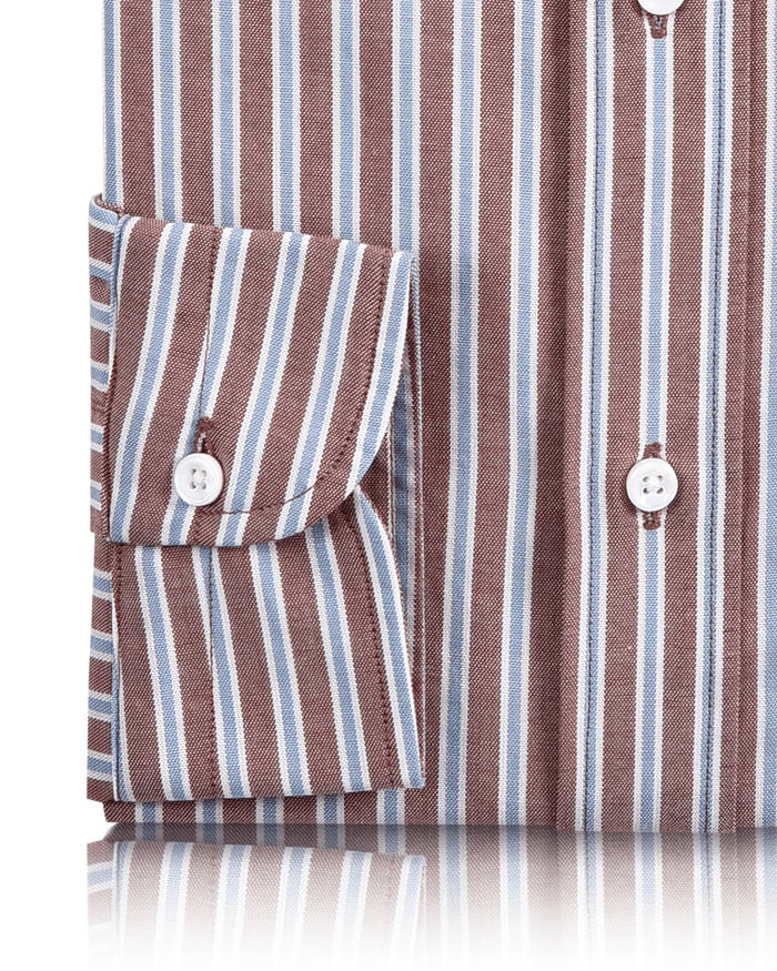Cuff of the custom oxford shirt for men by Luxire with blue white and rust stripes