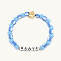 Blue beaded bracelet with 'BRAVE' word on a white background