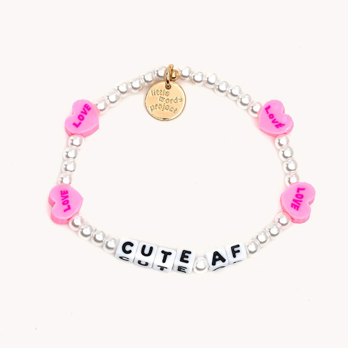 Silver Plated bracelet with pink hearts and the words CUTE AF