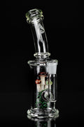 Clear glass water pipe (bong) with mushroom-themed percolator, isolated on black.