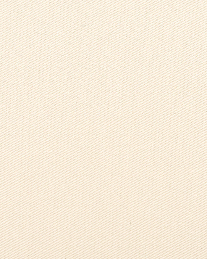 Close up view of custom Genoa Chino pants for men by Luxire in ivory cream
