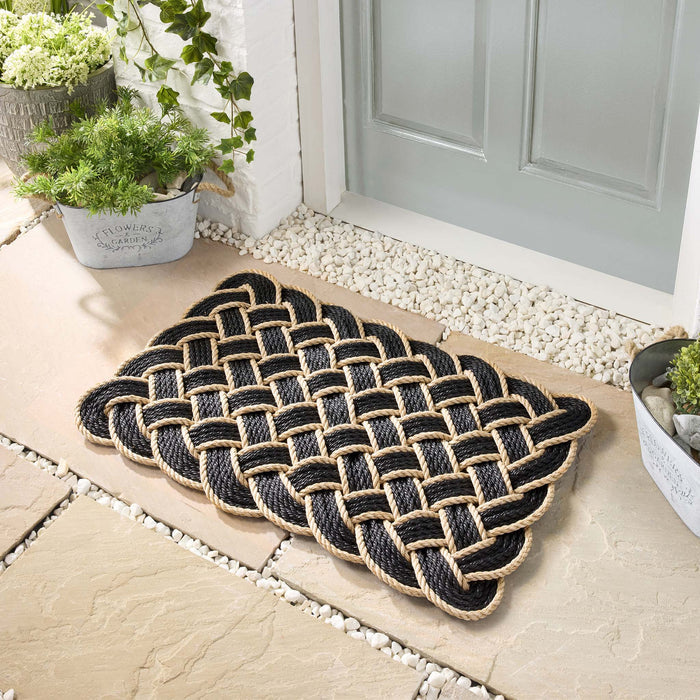 Lovers Knot black outdoor mat- featuring a rope design.