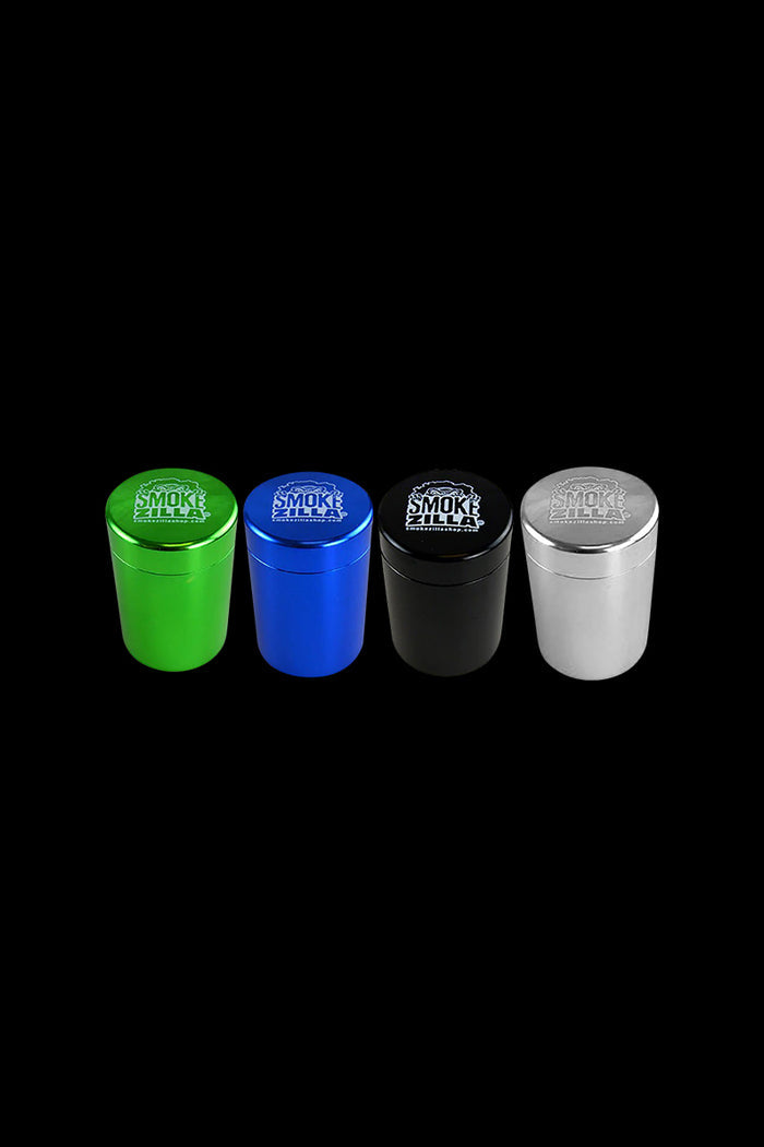 A studio shot displays the four Smokezilla Smell Proof Storage Jars, showcasing their sleek, dark design against a plain black background.