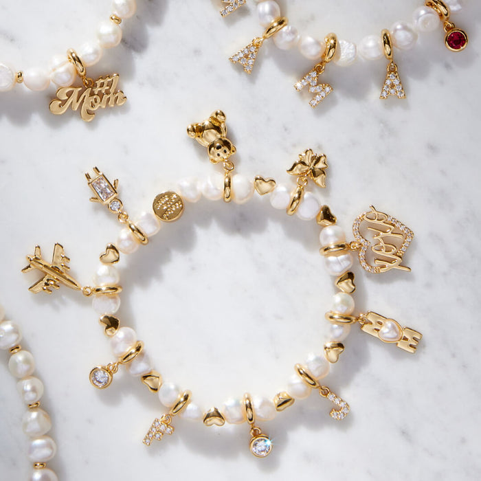 White Hearts by the Pearl Base Bracelet with Charms